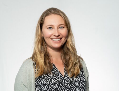 woman smiling plain background